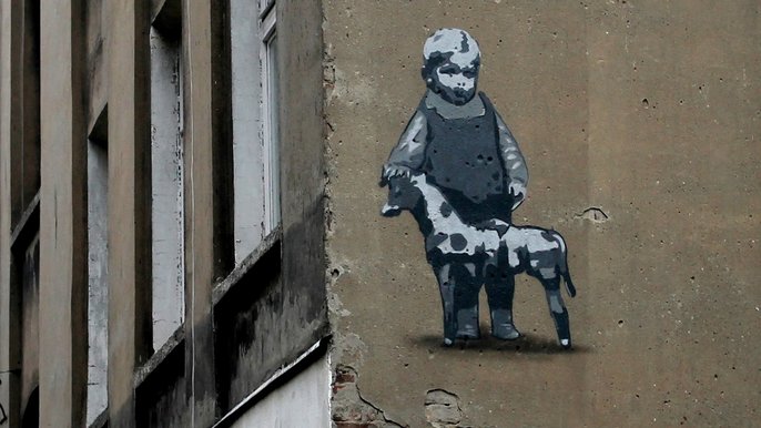 Łódź. Mural z wizerunkiem Abramka Koplowicza na ścianie kamienicy przy ul. Wojska Polskiego 70B