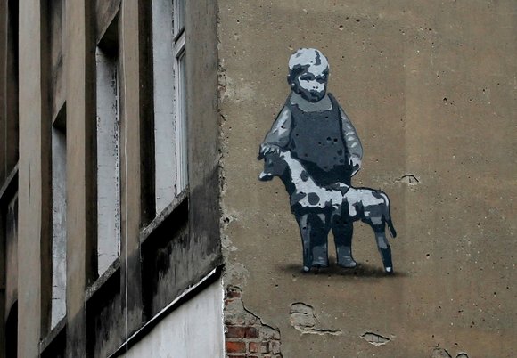 Łódź. Mural z wizerunkiem Abramka Koplowicza na ścianie kamienicy przy ul. Wojska Polskiego 70B