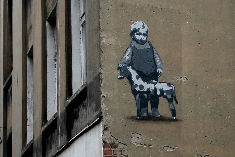 Łódź. Mural z wizerunkiem Abramka Koplowicza na ścianie kamienicy przy ul. Wojska Polskiego 70B